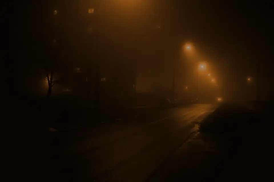 An empty road in orange fog